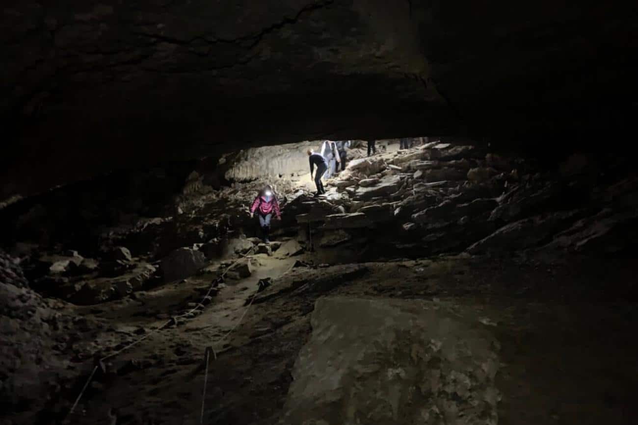 Cavers exploring the Metro Cave on the West Coast