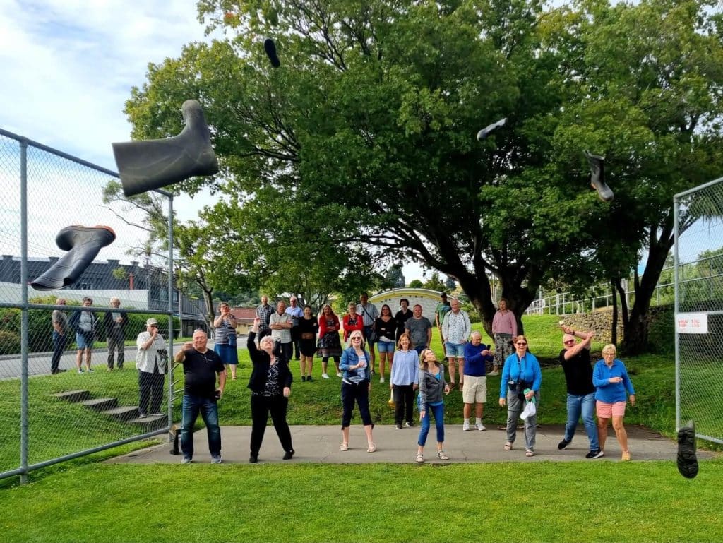 Travellers throwing gumboots in Taihape, New Zealand