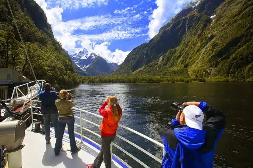 Taking photos on Milford Sound Cruise - NZ North and South Island Itinerary
