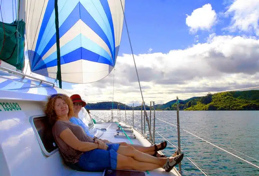 Relaxing on the yacht, sailing near Rotorua - NZ North Island Itinerary