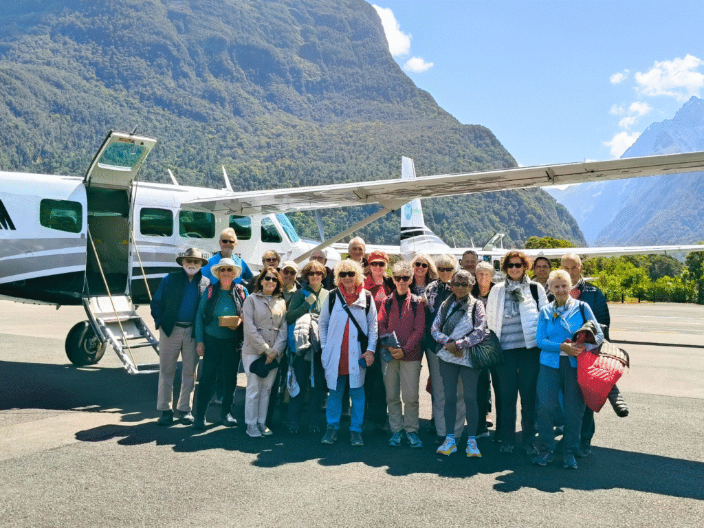Guests standing in front of Air Milford plane ready to fly back from Milford Sound over the Southern Alps