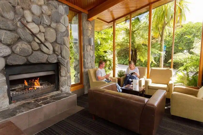 Guests relaxing in the lounge at the Scenic Hotel, Franz Josef Glacier