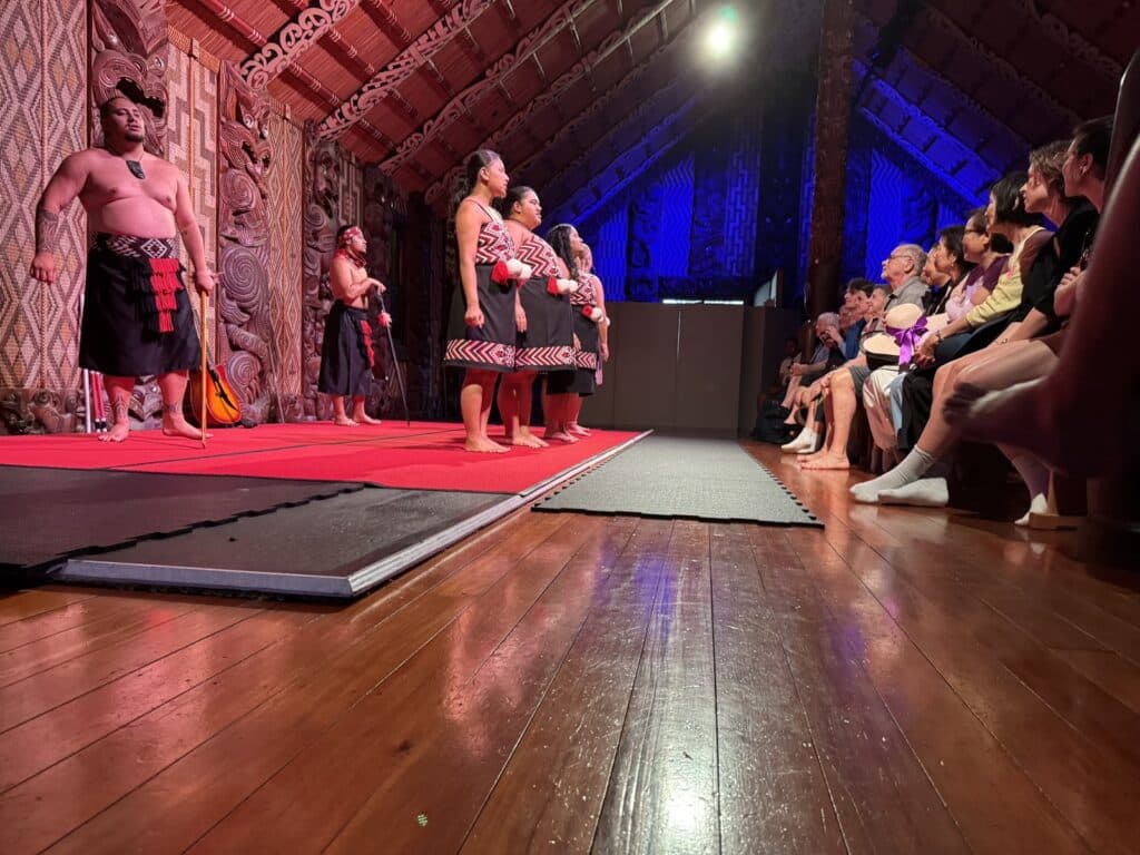 Visitors enjoying a Maori cultural performance in New Zealand