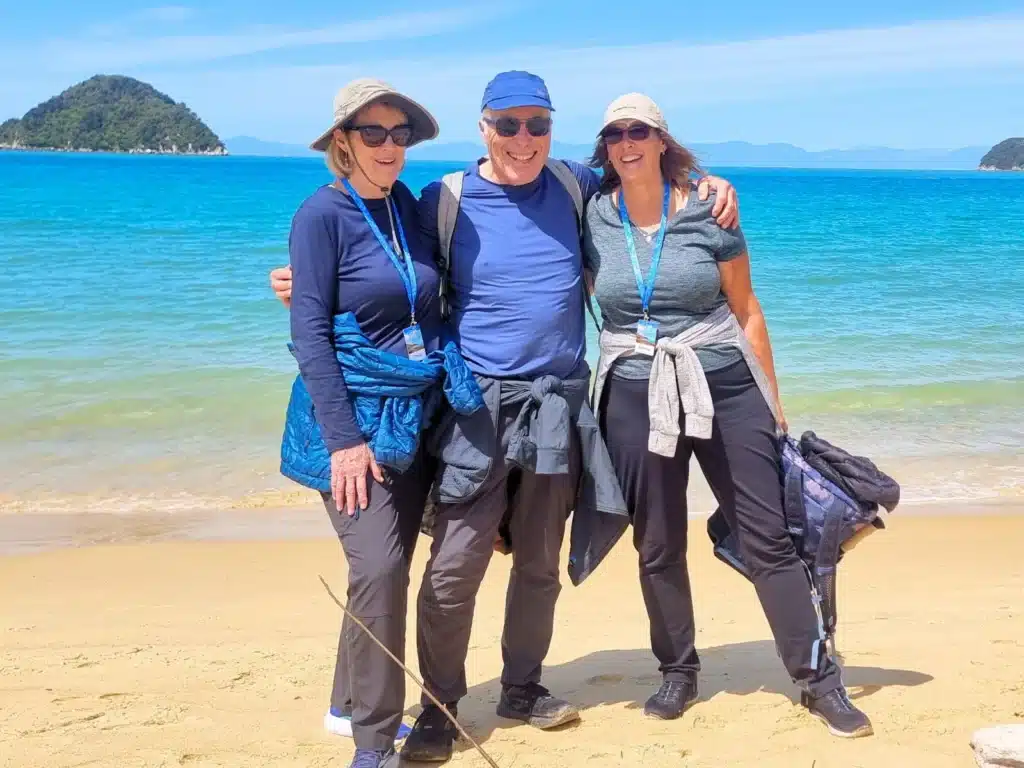 Senior travellers on the beach at Abel Tasman, New Zealand