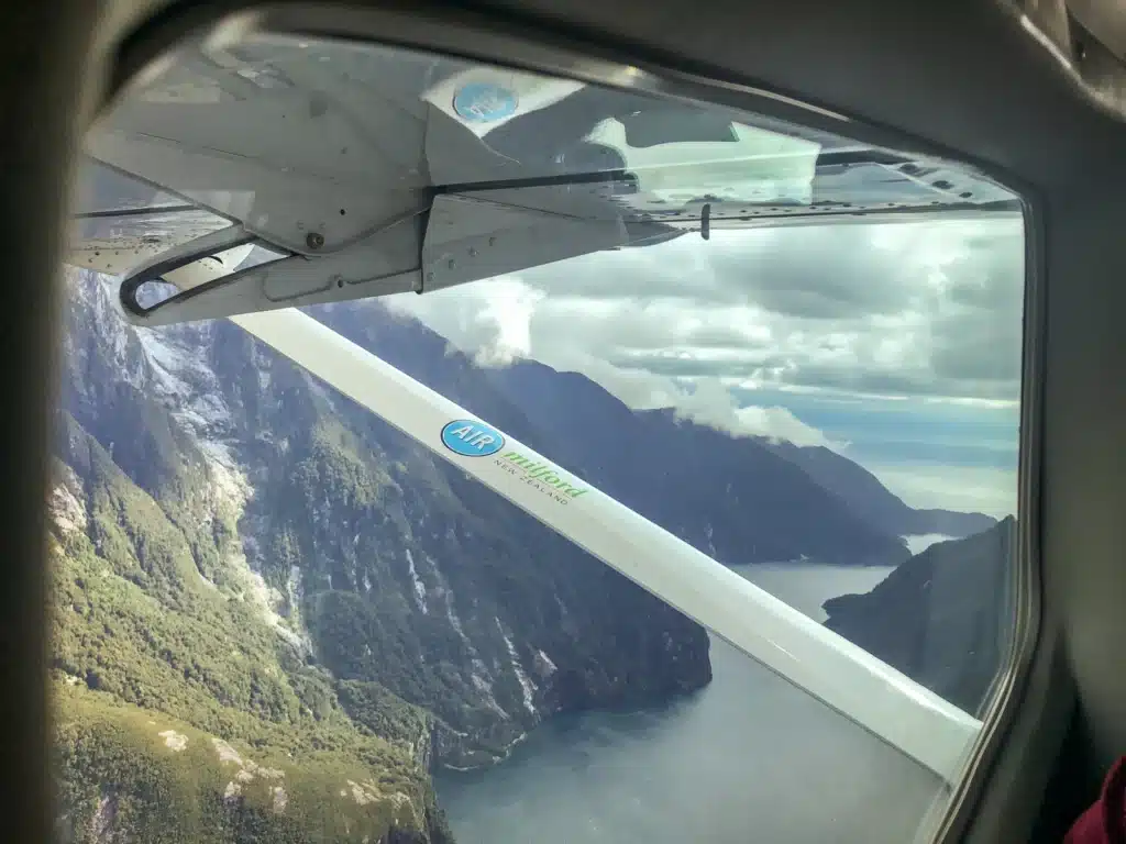 Views of Milford Sound out the window of a scenic flight