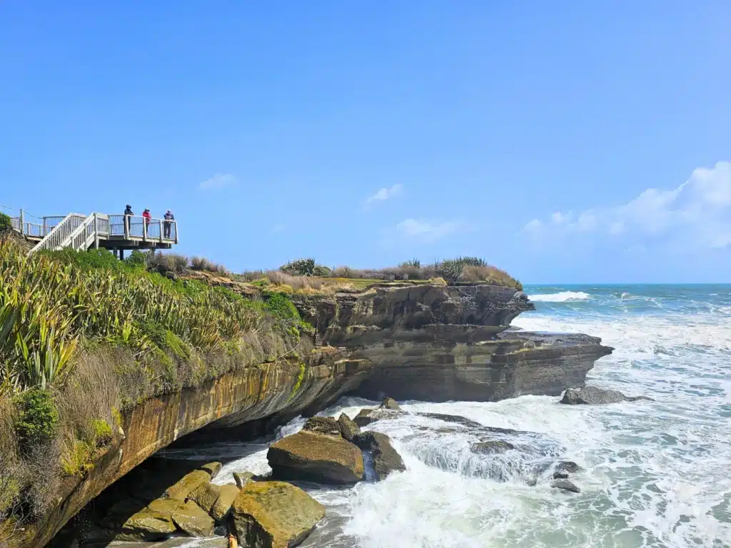 Travellers on the lookout at the Pancake Rocks, Punakaiki, New Zealand