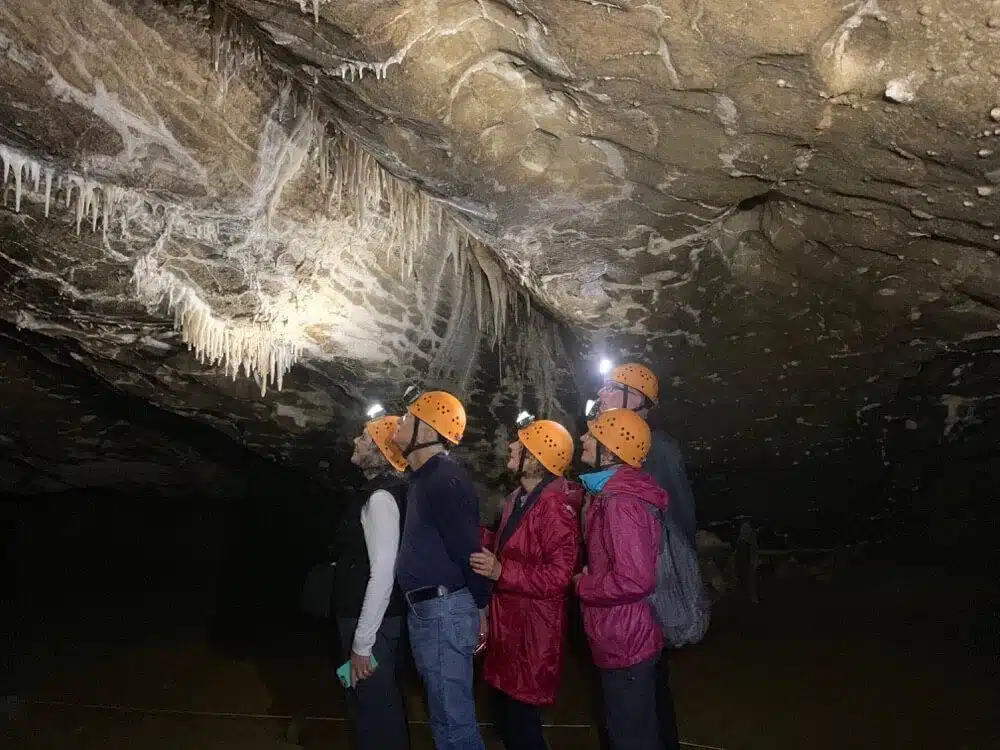 Travellers on a guided caving tour on the West Coast of the South Island, New Zealand