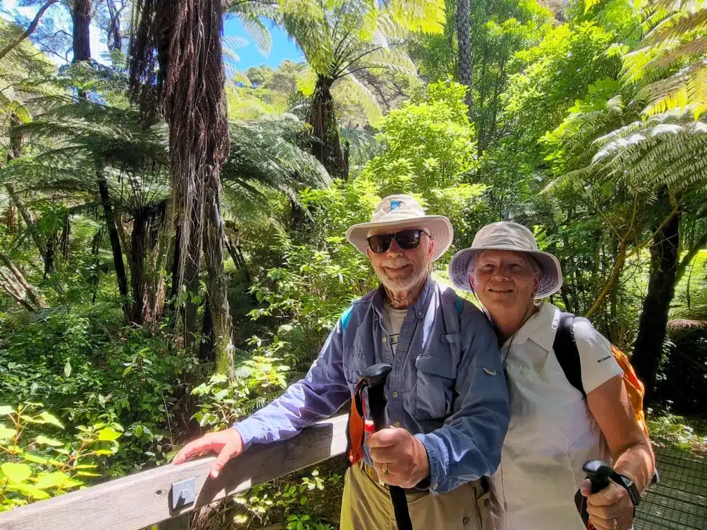 An elderly couple walking in Abel Tasman National Park, New Zealand