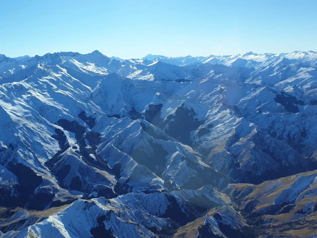 Views of the snowy mountains around Queenstown from a scenic flight